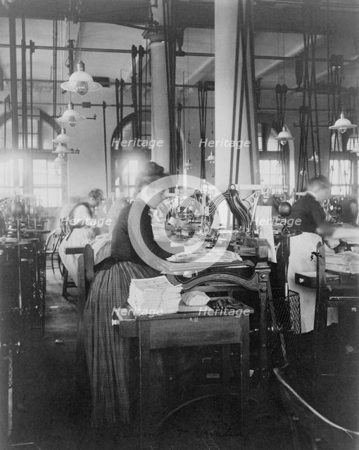 Women operating machinery at the Bureau of Printing and Engraving, Washington, D.C., 1889 or 1890. Creator: Frances Benjamin Johnston.