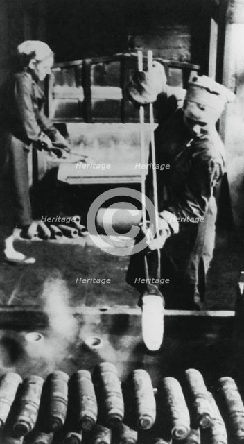 Women manufacturing shell casings in a Russian factory, World War II, 1943. Artist: Unknown