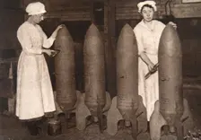 Women munitions workers putting a coat of paint on aerial bombs, World War I, c1914-c1918. Creator: S and G