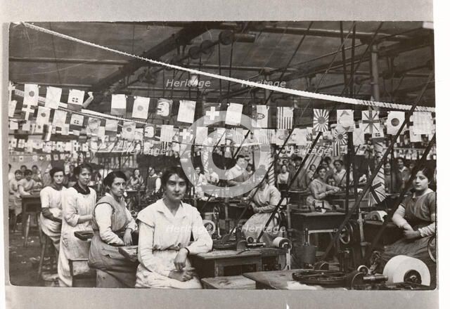 Women sat by their machines, Mackintosh Factory, Halifax, West Yorkshire, 1918. Artist: Unknown