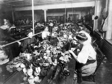 Women sewing teddy bears in a factory, c. 1915