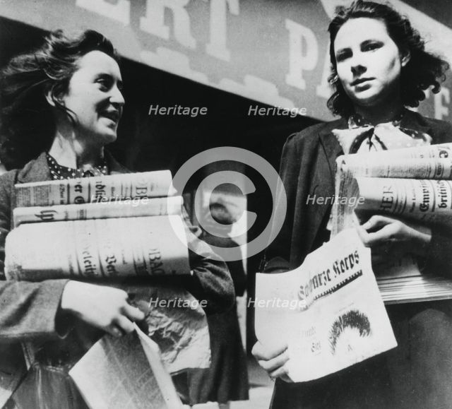 Women selling German newspapers, German-occupied Paris, 19 July 1940. Artist: Unknown