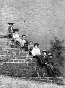 Women sitting on steps of an unidentified building, Hellidon, Northamptonshire, c1896-c1920. Artist: Alfred Newton & Sons
