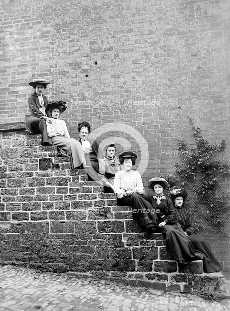 Women sitting on steps of an unidentified building, Hellidon, Northamptonshire, c1896-c1920. Artist: Alfred Newton & Sons.