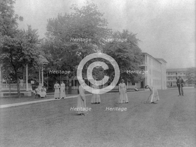 Women student activities - playing croquet, Carlisle Indian School, Carlisle, Pennsylvania, 1901. Creator: Frances Benjamin Johnston.