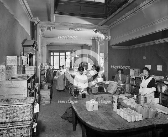 Women packing groceries at the National Food Fund building, London, February 1915. Artist: Adolph Augustus Boucher.