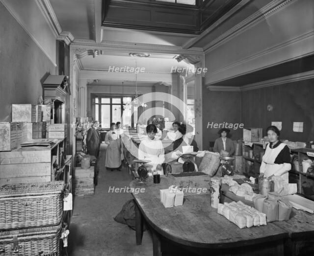 Women packing groceries at the National Food Fund building, London, February 1915. Artist: Adolph Augustus Boucher.