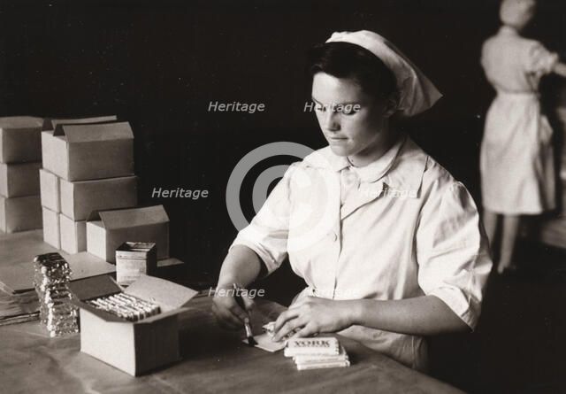 Women pasting York Chocolate, Rowntree factory, York, Yorkshire, 1949. Artist: Unknown