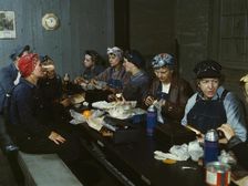 Women workers employed as wipers in the roundhouse having lunch..., C&NWRR., Clinton, Iowa, 1943. Creator: Jack Delano