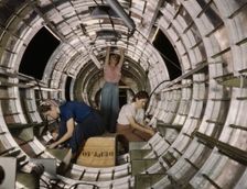 Women workers install fixtures and assemblies...Douglas Aircraft Company, Long Beach, Calif. , 1942. Creator: Alfred T Palmer
