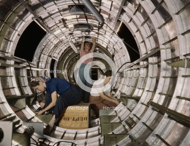 Women workers install fixtures and assemblies...Douglas Aircraft Company, Long Beach, Calif. , 1942. Creator: Alfred T Palmer.