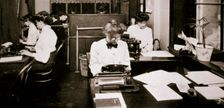 Women working in a typing pool, 1900. Creator: Unknown