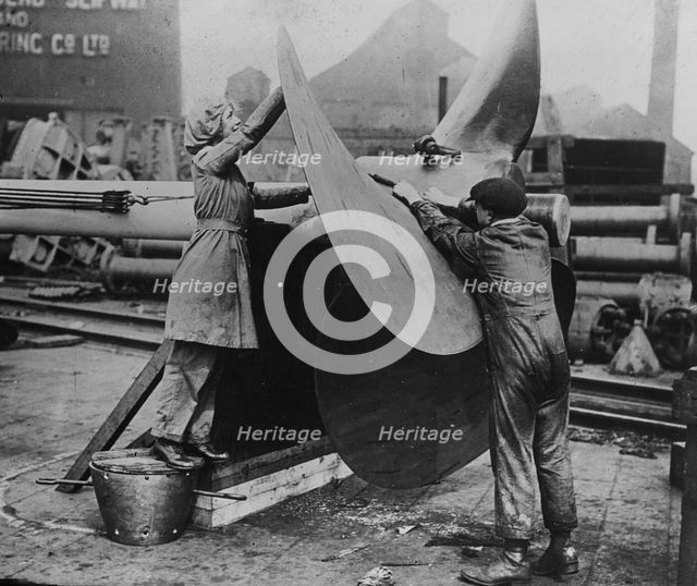 Women working on propeller, Eng. [i.e. England], between c1915 and 1917. Creator: Bain News Service.