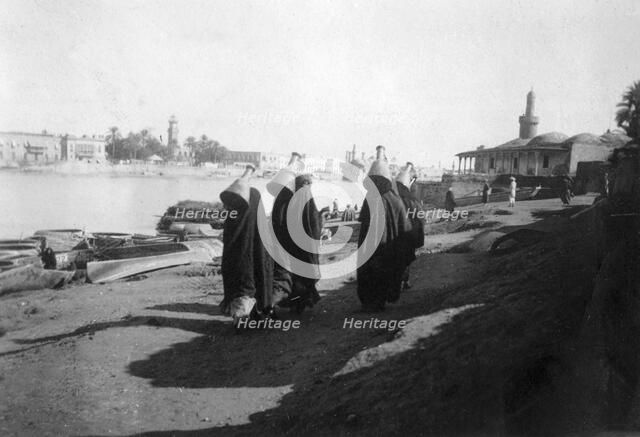 Women water carriers, Tigris River, Baghdad, Iraq, 1917-1919. Artist: Unknown