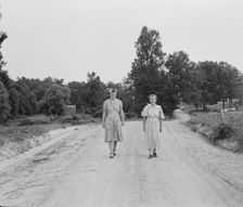 Women walking down the road to see a sick neighbor, Person County, North Carolina, 1939. Creator: Dorothea Lange
