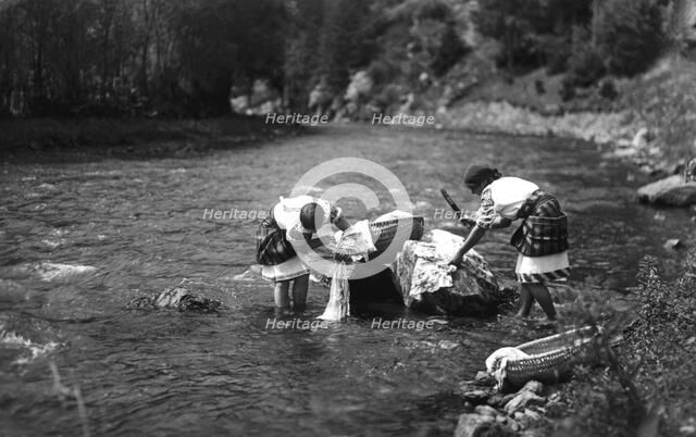 Women washing their laundry in a river, Bistrita Valley, Moldavia, north-east Romania, c1920-c1945. Artist: Adolph Chevalier