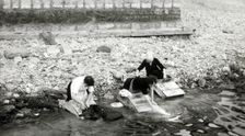 Women washing clothes on the shore of Lago Maggiore, Isola Bella, Italy, c1955. Creator: Arthur Charles Kirby Ware