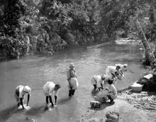 Women washing clothes in the river, Port Antonio, Jamaica, c1905. Artist: Adolphe Duperly & Son