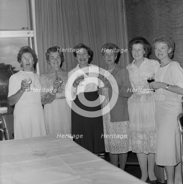 Women with celebratory drinks at the retirement presentation of Mary Coldicott
, 01/08/1986. Creator: John Laing plc.
