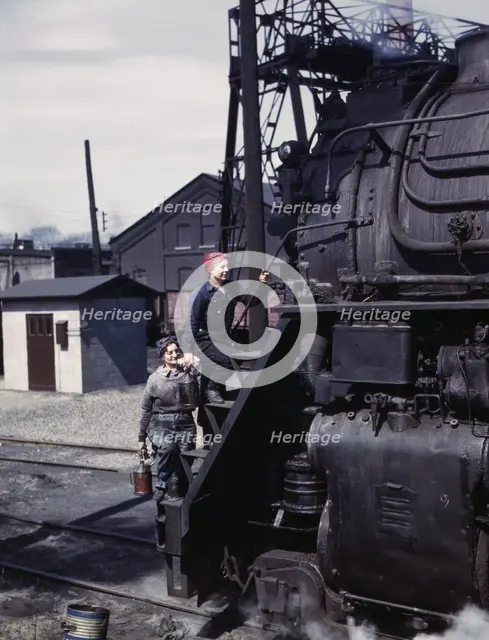 Women wipers of the Chicago and North Western Railroad cleaning one of the..., Clinton, Iowa, 1943. Creator: Jack Delano.