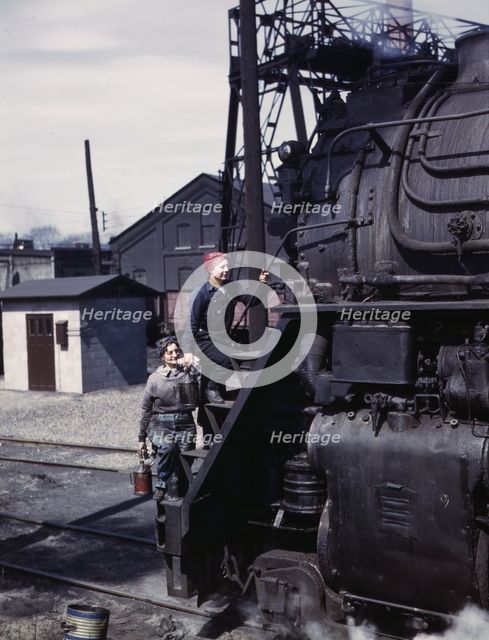 Women wipers of the Chicago and North Western Railroad cleaning one of the..., Clinton, Iowa, 1943. Creator: Jack Delano.