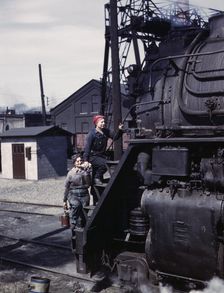 Women wipers of the Chicago and North Western Railroad cleaning one of the..., Clinton, Iowa, 1943. Creator: Jack Delano