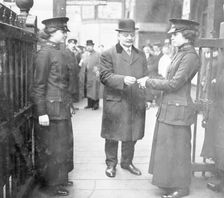 Women ticket collectors, London Bridge Station, London, May 1915