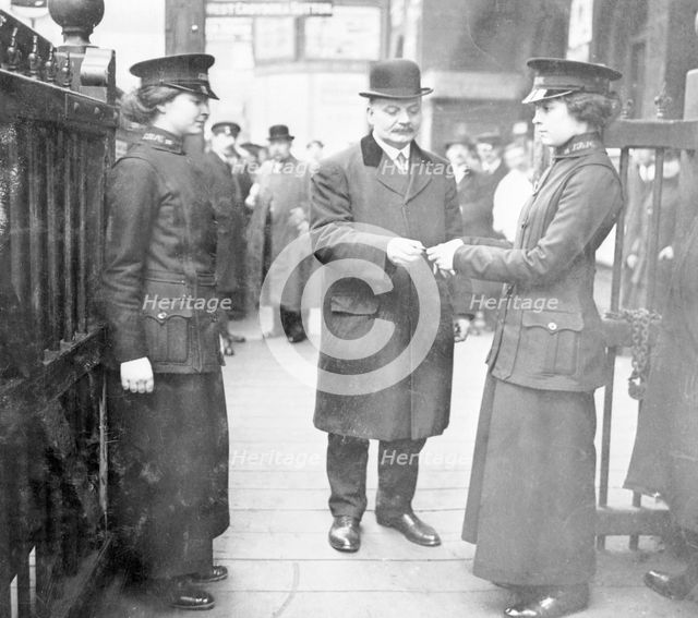 Women ticket collectors, London Bridge Station, London, May 1915. Creator: Unknown.
