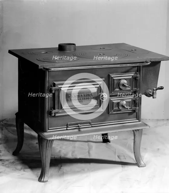 Wood burning stove, manufactured by Landskrona Foundry, Sweden, 1900.    Creator: Unknown.