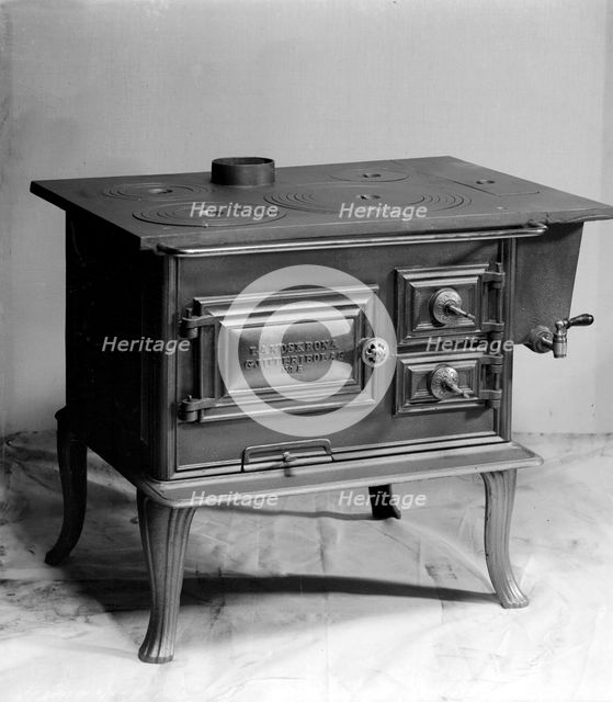 Wood burning stove, manufactured by Landskrona Foundry, Sweden, 1900.    Creator: Unknown.