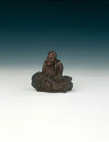Wood carving of luohan and rock, Qing dynasty, China, 1644-1911. Creator: Unknown