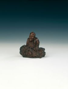 Wood carving of luohan and rock, Qing dynasty, China, 1644-1911. Creator: Unknown