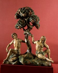 Wood carving representing The Dream of paradise with Adam and Eve