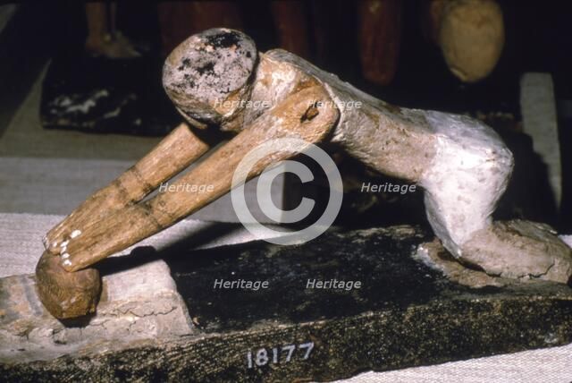Wood Model of Woman Grinding Corn, Egyptian Tomb Finding, c1900 BC. Artist: Unknown.