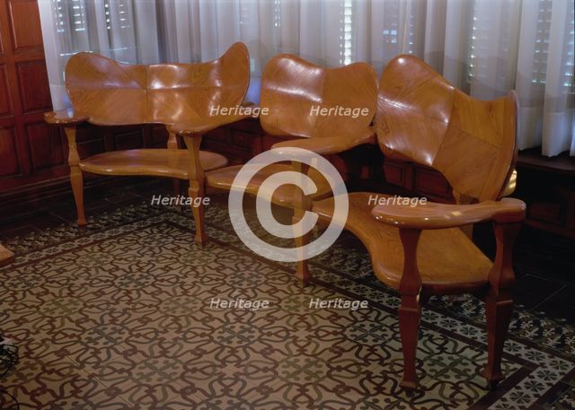 Wood sofa in the dining room of the Casa Batllo, 1904-1906, designed by Antoni Gaudi.