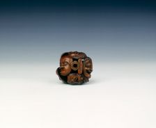 Wooden netsuke of seven Noh masks, late Edo period, Japan, 19th century. Creator: Koyosai