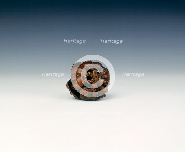 Wooden netsuke of seven Noh masks, late Edo period, Japan, 19th century. Creator: Koyosai.