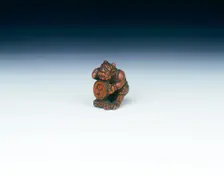 Wooden netsuke of Raiden beating a drum with a gourd, Japan, late 18th century. Creator: Unknown