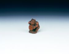 Wooden netsuke of Raiden beating a drum with a gourd, Japan, late 18th century