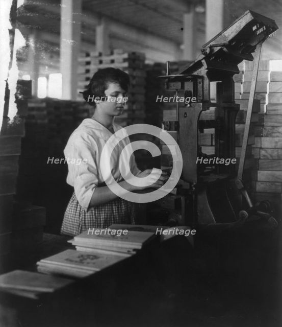 Wooden Box Industry: young woman working at machine, c1910. Creator: Frances Benjamin Johnston.