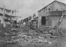 Wooden home of Alaskan Eskimo family, (1929?). Creator: Unknown