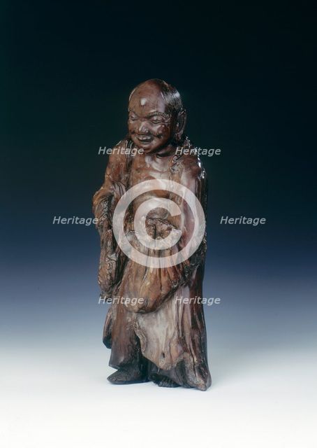 Wooden Liu Hai figure with three-legged toad, early Qing dynasty, China, c18th century. Creator: Unknown.