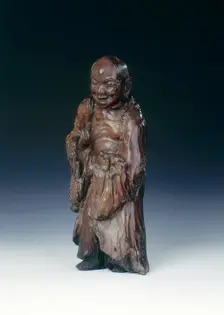 Wooden Liu Hai figure with three-legged toad, early Qing dynasty, China, c18th century. Creator: Unknown