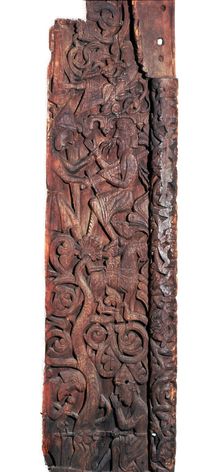 Wooden portal of Hylestad church, showing Sigurd roasting the dragon's heart