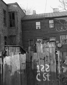Wooden privies in the Negro area, Washington (southwest section), D.C., 1942. Creator: Gordon Parks