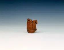 Wooden toggle of a monk, monkey, pig and horse on the back of a turtle, China, 17th century. Creator: Unknown