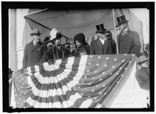 Woodrow Wilson and wife Ellen with unidentified on viewing stand, between 1910 and 1914. Creator: Harris & Ewing