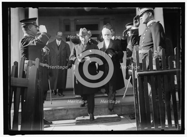 Woodrow Wilson descending steps with unidentified persons, between 1910 and 1917. Creator: Harris & Ewing.