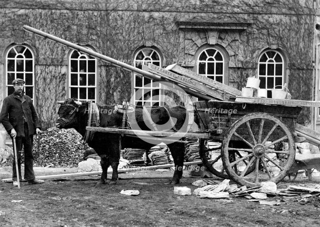 Workman posing outside a house with a bullock cart, Kingston Lisle, Oxfordshire, c1860-c1922. Artist: Henry Taunt