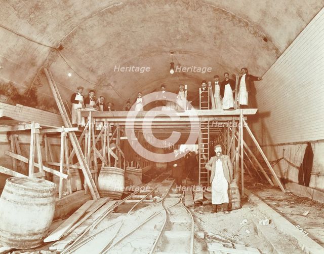 Workmen tiling the Rotherhithe Tunnel, London, December 1907. Artist: Unknown.